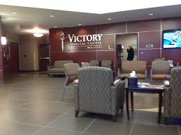 Andrew Hillman. Victory Medical Center lobby. Victory Medical Center Mid Cities wall sign. Past ownership.